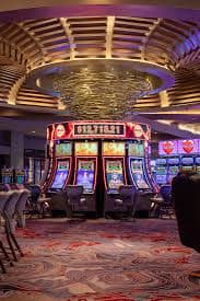 Hacksaw Gaming slot interface displayed on mobile phone showing spinning reels and balance update